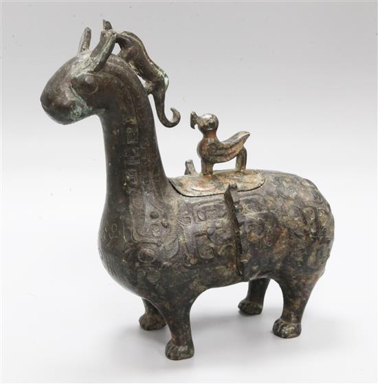 An archaistic bronze animal vessel and cover